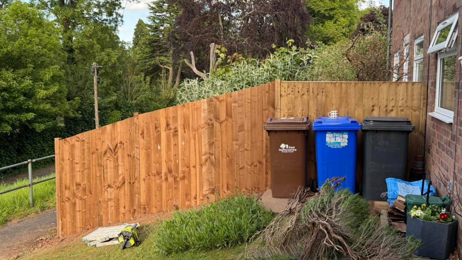 Close board fencing on sloped garden in Derby